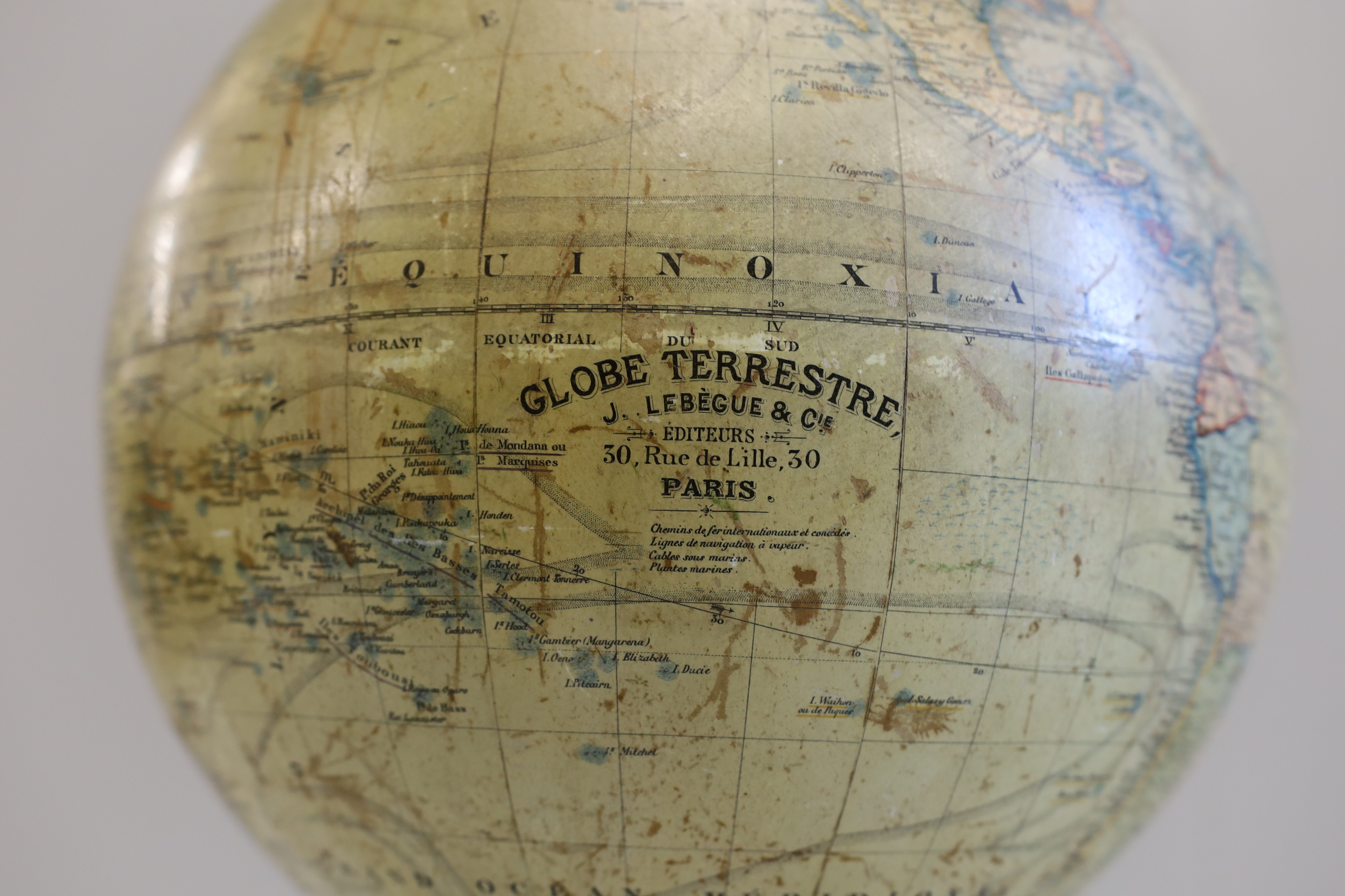 A 19th century 12 inch French globe, ‘Globe Terrestre’ published by J. Lebegue & Cie., Paris, on ebonised pine stand with inset compass, 53cm high on stand